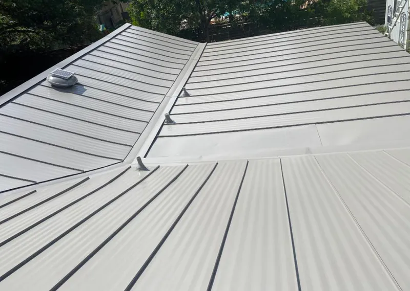 Solar attic fan installed on a metal roof for Roof Ventilation in Tarpon Springs